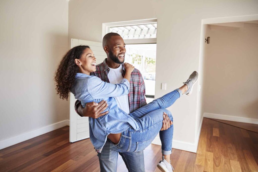 A Young Couple is Getting Familiar with Common Mortgage Terminology in El Paso, TX