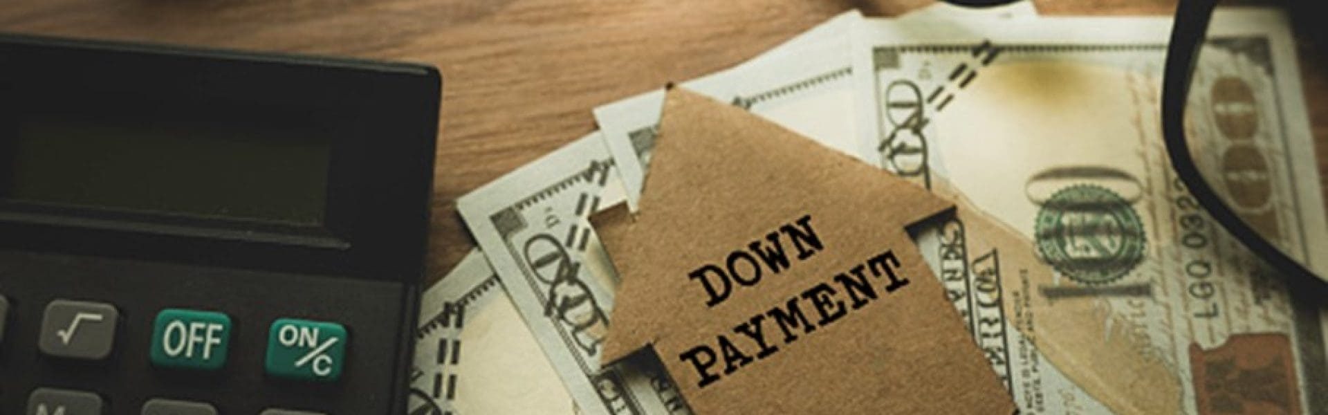 Down payment concept with cash and calculator in El Paso, TX & New Mexico