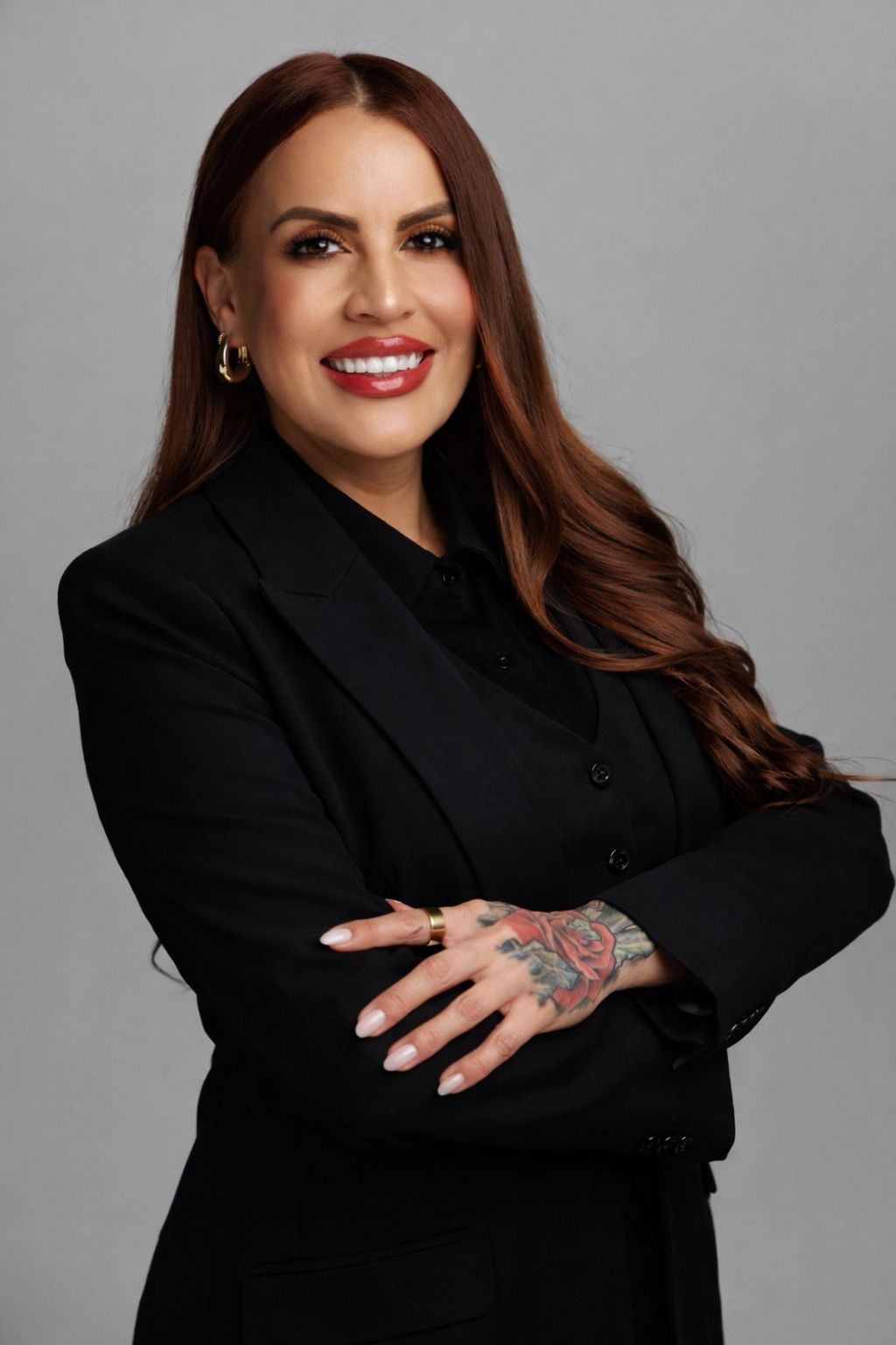 Loan Officer Evelyn Lopez, in a black suit with folded arms, in El Paso, TX & New Mexico