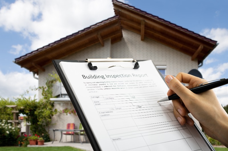 Home inspector reviewing property checklist in El Paso, TX & New Mexico