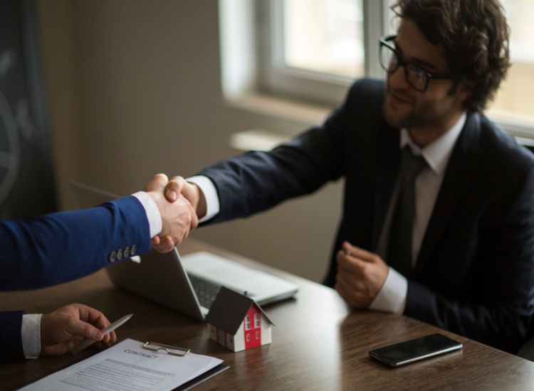 Real estate deal handshake representing property agreements in El Paso, TX and New Mexico